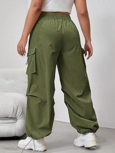 Embrace the utility trend with our Flap Side Pocket Drawstring Waist Loose Cargo Pants. These long-length pants combine practicality and style effortlessly. The loose fit and natural waistline provide all-day comfort, while the button details and flap side pockets add a touch of rugged charm. Made from durable woven fabric, these cargo pants are built to withstand daily wear and tear. Specifications: Details: Button, Pocket Waist Line: Natural Fit Type: Loose Type: Cargo Pants Length: Long Fabri Baggy Green Bottoms With Drawstring, Wide Leg Bottoms For Spring Outdoor Activities, Green Drawstring Bottoms For Outdoor, Wide Leg Bottoms For Outdoor Spring Activities, Green Outdoor Bottoms With Drawstring, Outdoor Green Drawstring Bottoms, Baggy Ankle-length Cargo Pants With Drawstring, Utility Bottoms With Drawstring And Loose Fit, Baggy Bottoms With Elastic Waistband For Outdoor Activities