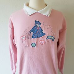 Adorable pink sweatshirt with sewing decal and hearts on the collar. Brand is Bobbie Brooks, and there is no size/fabric tag (it seems like a medium, and fabric does have some stretch to it) so please be sure to read the measurements below carefully. Please refer to the measurements listed below in order to determine the correct fit. Returns/exchanges are not accepted at this time. Feel free to message me if you have any questions. Pit to pit: 21 inches Length: 25 inches Sleeves: 17.5 inches Retro Pink Sweatshirt For Fall, Retro Embroidered Cotton Sweater, Retro Cotton Embroidered Sweater, Vintage Embroidered Cotton Sweater, Retro Pink Sweatshirt For Winter, Vintage Long Sleeve Sweater For Loungewear, Retro Pink Long Sleeve Sweater, Pink Retro Long Sleeve Sweater, Vintage Pink Sweatshirt For Winter