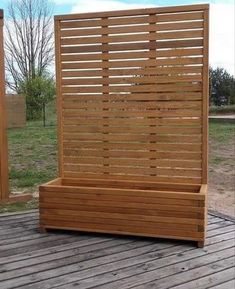 a wooden bench sitting on top of a wooden deck