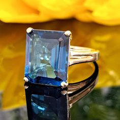 11.40 Carat Natural London Blue Topaz 14k Solid Gold Ring Material: 14k Solid Gold Approximate Weight: 5.9 Grams Band Width Approximately: 2.0 mm Gemstone: Natural London Blue Topaz Treatment: Heating Color: Dark Blue Clarity: Eye Clean Shape: Emerald Cut Approximate Dimensions: 14.00x12.00 mm Approximate Carat Weight: 11.40 Carat Ring Quantity: One Ring Condition: New Delivered in an elegant jewelry box Made in Los Angeles, CA  Please do not hesitate to ask any questions and we will be happy to assist You 💜 Jewellery Box Making, One Ring, London Blue Topaz, London Blue, Topaz Ring, White Rose Gold, Elegant Jewelry, Solid Yellow, White Rose