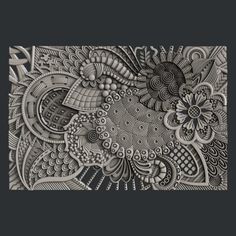 an intricately designed piece of paper with flowers and leaves in the center on a black background