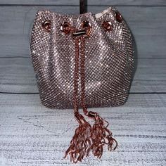 Nwt Rose Crystal, With Tassel Lock, Bucket Bag Stainless Steel 24" Drop Strap Approx 9.5"X6.7"X6.7" Shoulder Strap Is Removable *See Silver Bag Listing For View With Shoulder Strap Attached* This Beautiful Bag Weighs Just Over One Pound, As The Lock, Grommets, Shoulder And Draw Strap Are Stainless Steel Metal. It Is Simply Stunning!! Great For Parties, Events And Holidays!! Pink Evening Pouch Bucket Bag, Pink Pouch Bucket Bag For Evening, Pink Evening Bucket Bag Shaped As Pouch, Pink Evening Bucket Bag, Glamorous Party Bags With Tassels, Pink Party Bucket Bag, Party Pouch Bag With Tassels, Crystal Bucket, Chanel Double Flap