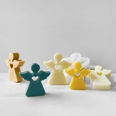 small ceramic figurines in various colors and shapes