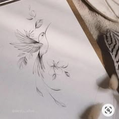 a drawing of a bird with flowers on it