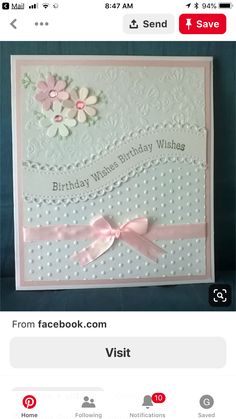 a birthday card with pink ribbon and flowers on the front, is displayed in an instagram