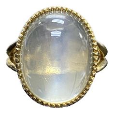 DeKara Designs Collection Art Deco Inspired Extremely Elegant Handmade Oval Cabochon Moonstone Engagement Ring. Metal- 18K Yellow Gold, .750. Stones- 1 Genuine Oval Cabochon Moonstone 19.67 Carats. Size- 8 3/4. FREE SIZING!!!! An Amazing One of a Kind Entirely Handmade Cabochon Huge Moonstone Engagement Created in 18K Yellow Gold. The ring features a beautiful high quality and clarity oval cabochon moonstone that is a whopping 19.67 carats! The moonstone is gracefully and professionally bezel set with perfection. The moonstone is surrounded by beautiful milgrain work which brings out the stone furthermore. The profile of the ring is truly amazing with flawless work that is finished with a high polish shine finish. This ring is one of a kind, and is entirely handmade. The moonstone is very Luxury Domed Cabochon Moonstone Ring, Luxury Oval Cabochons For Wedding, Luxury Oval Cabochon Elegant Jewelry, Luxury Spiritual Oval Cabochon Rings, Luxury White Oval Cabochon Moonstone Ring, Luxury Marquise Cabochon Jewelry, Luxury Rose Gold Oval Cabochon Jewelry, Moonstone Rings, Moonstone Engagement