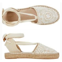 Natural Espadrille Style Sandal With Embroidery And Tie Around Ankle Laces. White Flat Espadrille Sandals, Embroidered Closed Toe Sandals For Beach, Cream Ankle Strap Espadrille Sandals, White Embroidered Closed Toe Sandals, Embroidered Closed Toe Espadrilles For Summer, Summer Embroidered Espadrilles With Round Toe, Spring Embroidered Adjustable Sandals, Flat Embroidered Sandals For Beach, Embroidered Flat Espadrilles For Summer