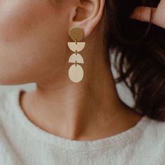 These modern, bold statement earrings are perfect for any occasion. They are great for work but can also be dressed up to make a big impact that completes your look! + The studs are made from high quality stainless steel. Great for even sensitive earrings.  + Brass oxidizes over time, meaning it will change the more you wear it to give it that beautiful aged look. You can also polish them to their original shine very easily with many home remedies or polishing cloths. Avoid wearing them in the s Big Statement Earrings, Geometric Statement Earrings, Earrings Studs, Trendy Earrings, Blue Jewelry, Gold Brass, Modern Earrings, Metal Earrings, Brass Earrings