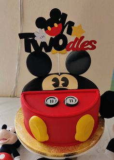 a mickey mouse cake on a table