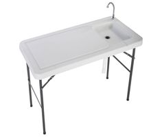 a white sink sitting on top of a table