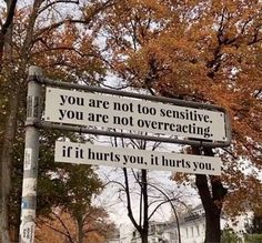 a street sign that says you are not too expensive, you are not overreacing if hurts you, it hurts you