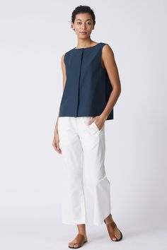 Sweet and simple, our Colette Shell is the perfect Spring into Summer top. With a boatneck shape, this charming top will soon be your bestie. Boat neck style with stitch down facing, center front hidden placket with top button exposed, back inverted pleat with stitch detail, wide finish hem - 51% Cotton, 49% Nylon - Fabric woven in Italy - Made in NYC - Dry clean or machine wash - Our model is 5'9" wearing size S - Chest 39", Hip 42", Length 23" Orders are processed within three business days (n Spring Into Summer, Nylon Fabric, Summer Top, Cotton Tops, Boat Neck, Woven Fabric, Shells, Dry Clean, Italy