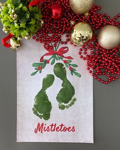 a christmas card with the word mistette's on it next to ornaments and balls