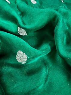 SILK MARK CERTIFIED !!! Gorgeous Pure Chiffon Silk Saree in Bottle Green Color with Sliver Zari Work. Item : SareeBase Fabric : Pure Chiffon Color : Bottle Green Blouse piece : Comes with un-stitched Blouse piece.Blouse material : Pure ChiffonFall & Edging(Yes/No) : YesSilk Mark Certificate given with the Saree(Yes/No) : YesDisclaimer -:- Color variation is possible due to various reasons like phone or desktop setting, resolution etc. Please don't hold us responsible. Our aim is to put the exact Festive Silver Silk Dupatta, Festive Silver Blouse Piece With Zari Work, Festive Silver Blouse Piece For Festivals, Festive Silver Blouse Piece, Silver Silk Traditional Wear For Wedding, Elegant Silver Blouse For Festive Occasions, Festive Silver Saree Blouse Piece, Silver Blouse Piece With Traditional Drape For Eid, Festive Silver Silk Traditional Wear