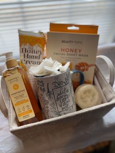 a basket filled with lots of different items on top of a white cloth covered table