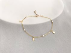 The pearl bracelet/ Anklet is hand-crafted using Premium Crystal Pearls and gold-filled charm. This Moon and Star bracelet is perfect for bridesmaid wedding gift, birthday gift and friends or any occasion. Bracelet Length :   16.5 , 17.5 cm, 17.5cm+2.5cm extension chain .  Anklet Length: 23cm+2.5 cm,  24cm + 2.5cm.  Material: gold filled Moon, Star charms, 3mm white Premium Crystal Pearl  (4 pearls) gold filled chain and gold filled findings or  Rose gold filled Moon, Rose gold filled Star charm Gold Charm Bracelet With Moon Charm As A Gift, Gold Bracelet With Star Charm For Gift, Gold Bracelet With Star Charm As Gift, Gold Bracelets With Star Charm For Gift, Dainty Gold Bracelets With Moon Charm, Dainty Gold Bracelet With Moon Charm, Delicate Wedding Jewelry, Delicate Gold Bracelet, Silver Bracelet Designs