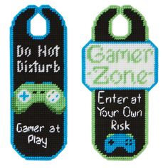 two cross stitch bookmarks with the words game at your own and do not disturb