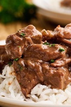 meat and rice are served on a plate