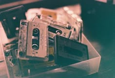 an old fashioned cassette player sitting on top of a table