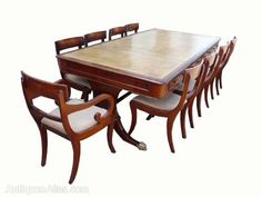 a dining table with six chairs and a bench on the bottom one is made out of wood