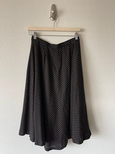 "Traditional vintage circle skirt. Has belt loops around the waist. Inside is lined. I'm great vintage condition.  **found with no contents label Feels to be rayon  Measurements-  Waist: 28\" Length: 27\" Hip: 40\"" Vintage Black Pleated Skirt, Black Vintage Pleated Skirt, Retro Black A-line Skirt, Vintage Black Long Skirt, Vintage Black Flared Skirt, Vintage Black Gathered Skirt, Black Retro A-line Skirt, Retro Black Long Skirt, Black A-line Retro Skirt