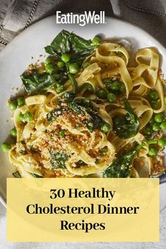 a white plate topped with pasta and peas