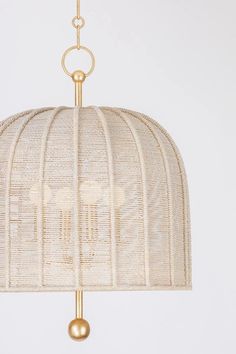 a white and gold lamp hanging from a ceiling