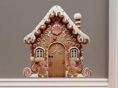 a gingerbread house is decorated with candy canes