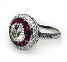 "𝐃𝐞𝐬𝐜𝐫𝐢𝐩𝐭𝐢𝐨𝐧 : *Antique Ruby Double Halo Ring, Round Cut CZ Diamond Vintage Ring, Woman's Engrave Shank Ring, Art Deco Engagement Ring, Birthday Gift Ring. ❖ 𝐃𝐢𝐚𝐦𝐨𝐧𝐝 𝐃𝐞𝐭𝐚𝐢𝐥𝐬 *Color : White, Pink *Clarity : VVS *Cut : Excellent *Center Stone Shape : Round Cut *Center Stone Size : 6.00 MM *Center Stone Weight : 0.85 CT *Side Stone Size : 1.40, 2.2*1.8 MM *Type : Cubic Zirconia (CZ) *We have all types of fancy & color Gemstone. For more queries please contact us immediately. ❖ 𝐑𝐢𝐧𝐠 𝐃𝐞𝐭𝐚𝐢𝐥𝐬 *Metal Purity : Solid Gold (10K, 14K, 18K); 925 Sterling Silver *Stamp : Yes (As per metal purity) *SKU : SR4479 *Making Process : Handmade > Crafted by our experienced craftsman. ❖ 𝐂𝐮𝐬𝐭𝐨𝐦𝐢𝐳𝐚𝐭𝐢𝐨𝐧 *Buyer can Request change of rhodium color in 925 Silver Jewelr Dazzling Round Ruby Ring With Halo Setting, Dazzling Ruby Ring With Halo Setting, Anniversary Ruby Ring In Diamond White, Diamond White Ruby Ring For Anniversary, Anniversary Diamond White Ruby Ring, White Ruby Ring With Halo Setting For Anniversary, White Ruby Ring With Center Stone For Anniversary, Exquisite Ruby Ring With Center Stone, White Ruby Ring With Halo Setting For Wedding