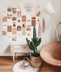 a living room with a cactus in the corner and pictures on the wall behind it