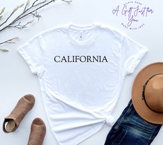 California T-Shirt, California Tee,  Cali Girl Shirt, Trendy California Shirt, California State, Unisex T-Shirts, Free Shipping This listing is for one premium T-shirt  - 100% Airlume Combed and Ringspun Cotton Bella+Canvas 3001 is a Unisex t-shirt extremely soft and comfortable to wear. This is the perfect shirt for the one you love! Our T-Shirts are high quality, super soft, and comfy. Made with top-of-the-line vinyl and pressed with a professional-grade heat press.  Please be advised before y California Shirt, Cali Girl, California State, Perfect Shirt, Cali, Shirts For Girls, California, Gender Neutral, Tops & Tees