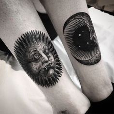 two people with tattoos on their legs and one has an evil face in the middle