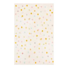 a white rug with multicolored polka dots on the front and back of it