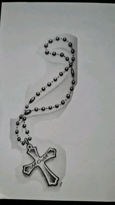 a drawing of a rosary with a cross on it