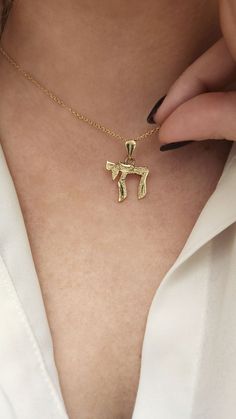 ★HEBREW CHAI GOLD NECKLACE★ My specially designed unisex CHAI gold pendant. 14K solid gold necklace. The "Chai" is a known Jewish and Hebrew word, symbol, amulet, and blessing.  The meaning it holds is 'life' and it is a symbol of good luck and a long good life. Chai Necklaces can be worn by people of all genders and ages. Mostly given as a Bar Mitzvah gift. Necklace Details: ★ Solid 14K gold, Choose your gold color yellow gold / white gold / rose gold ★ Choose the number of the style you want i 14k Gold Engraved Necklace For Good Luck, Good Luck Engraved 14k Gold Necklace, Gold Pendant Necklace For Good Luck, Yellow Gold Pendant Necklace For Good Luck, Yellow Gold Good Luck Pendant Necklace, Gold Initial Pendant Necklace For Good Luck, Gold Charm Necklace With Polished Finish In 14k Gold, Yellow Gold Pendant Charm Necklace For Good Luck, Yellow Gold Good Luck Pendant Charm Necklaces