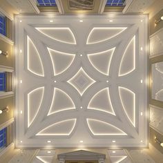 an overhead view of the ceiling in a large room with lights on and blue shutters