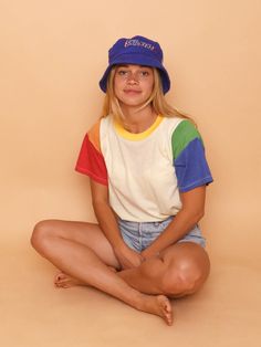 Even Oscar the Grouch himself couldn’t resist feeling happy in this colorful tee! Our latest crewneck tee features almost all of the colors of the rainbow, from the neckband to the contrasting sleeve panels. The body is our slightly sheer cream jersey for a neutral contrast. And we didn’t forget to include CAMP’s signature locker loop at the back neck, this time in sunshine yellow! If you’ve always wanted to wear a rainbow - now’s your chance. Fit / Sizing Unisex fit: true to size. Women’s fit: Outfit Ideas Summer Colorful, Summer Pride Outfit, Pride Outfit Ideas Women, Cute Pride Outfits, Band Tshirt Outfit, Sun Clothes, Whimsical Clothes, Color Block Tshirt, 80s Tshirts