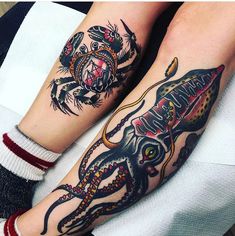 two people with tattoos on their legs and one has an octopus in the middle of it