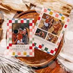 two christmas cards sitting on top of a plate