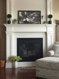 a living room with a couch and fireplace