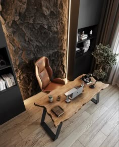 a wooden table sitting in front of a stone wall