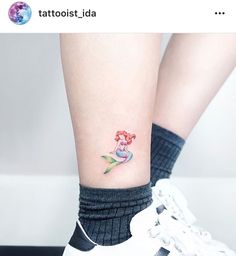 the little mermaid tattoo on the ankle is very cute and it looks like she's getting