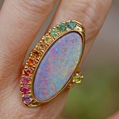 Take one 6.15ct Lightening Ridge dark opal (27 x 11 x 3mm), pick out an ombré rainbow of tourmalines (and one citrine and one amethyst) to match, set in 14k yellow gold and you'll be mesmerized for days on end. Ring face measures 35 x 15mm. Ring size 6.25. Sizing available Layaway available White Rings, Closet Edit, Rainbow Ring, Unique Opal, Ethiopian Opal Ring, Rainbow Rings, Magical Jewelry, Jewelry Accessories Ideas, Lightning Ridge