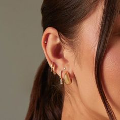 The Gold Dome Huggie Earring is a unique spin on a traditional huggie, thanks to its dome-like silhouette. Crafted from 14k gold, this huggie is perfect for everyday wear and looks just as good in the lobe as it does higher up the ear. Gold Teardrop Huggie Earrings Fine Jewelry, 14k Gold Huggie Cartilage Earrings, Sterling Silver Teardrop Huggie Earrings Tarnish Resistant, Tarnish Resistant Teardrop Sterling Silver Huggie Earrings, Modern 14k Gold Huggie Cartilage Earrings, Modern 14k Gold Filled Huggie Earrings, 14k Gold Teardrop Hoop Earrings With Polished Finish, 14k Gold Huggie Earrings For Everyday Fine Jewelry, Yellow Gold Dangle Huggie Earrings Fine Jewelry