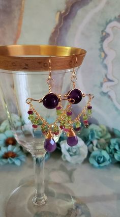 "Beautiful Green Peridot ,Purple Moonstone and Purple Agate and 14k Gold Filled Chandelier Earrings. These Earrings have wonderful Dangle and movement. These Earrings Measure approximately 3\" inches long by 1 3/8\" inches wide. Large Purple Moonstone Briolettes gemstones Dangle with Green Peridot, Purple Faceted Jade Rondelles, wire wrapped with 14K Gold Filled Wire. Below the French Earring wire is a 12mm beautiful Purple Agate. The Moonstone Brio;ettes are approximately 16mm ;ong x 10mm wide. Gold Multi-stone Chandelier Earrings As Gift, Gold Multi-stone Chandelier Earrings For Gift, Purple Gemstone Chandelier Earrings For Gift, Purple Multi-stone Dangle Jewelry, Purple Multi-stone Dangle Earrings, Gold Amethyst Dangle Chandelier Earrings, Purple Chandelier, Pretty Accessories, Earring Wire