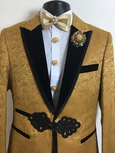 Our new gold, floral print, three piece tuxedo will be an excellent addition to your formal wardrobe. It's luxurious velvet collar will sport a look of elegance that all will notice. This tuxedo includes beautiful button covers, matching cufflinks, and a stunning bow tie. Fitted Luxury Tuxedo For Festive Occasions, Luxury Fitted Tuxedo For Festive Occasions, Festive Luxury Fitted Tuxedo, Elegant Gold Evening Set, Classic Gold Festive Sets, Classic Gold Festive Set, Classic Gold Sets For Festive Season, Luxury Gold Blazer With Notch Lapel, Elegant Gold Suits For Semi-formal Events