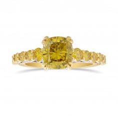 a yellow diamond engagement ring set in 18k gold