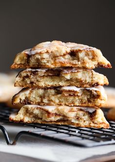 a stack of cookies sitting on top of a cooling rack