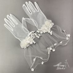 Step into bridal elegance with these handmade white tulle sheer gloves. Delicately adorned with crafted flowers around the wrist, they're more than just an accessory--they're a symbol of your unique love story. Embrace the magic of artisanal craftsmanship and set your bridal look apart with these exquisite gloves Length(fingertip to end): 37cm/14.6 inch Palm Length(finger tip to end of palm）：18cm/7.1 inch Shipping takes 12-15 business days after order confirmation. Inventory: As this product is Sheer Gloves, Gloves Outfit, Tulle Gloves, Formal Gloves, Wedding Gloves, Bridal Gloves, Hand Accessories, Bridal Elegance, White Tulle