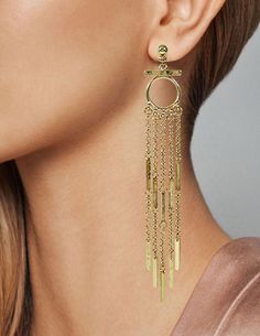 "Metal Tassel Fringe Long Dangle Drop Earrings Available Finished Colors : Gold, Silver, Rose Gold This pair of long fringe tassel earrings are classy, stylish and gives a chic look. These Earrings have intricate design, followed by beautiful chains of fringe tassel. Add some sparkle to your outfit with these earrings and feel like a diva! Unique and Beautiful Dangle Earrings A Must Have Jewelry Accessory For Your Collection. Reasonable Prices Designed in NY CITY Measurement: Approx: 5\"(L) Weig Elegant Fringe Metal Chandelier Earrings, Chic Dangle Tassel Earrings For Pierced Ears, Elegant Tassel Earrings With Dangling Charms For Party, Elegant Party Tassel Earrings With Dangling Charms, Chic Metal Dangle Tassel Earrings, Chic Metal Tassel Dangle Earrings, Linear Tassel Dangle Earrings, Chic Tassel Earrings, Long Drop Fringe Tassel Earrings